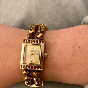 Dressbarn gold stretchy beaded dress watch.